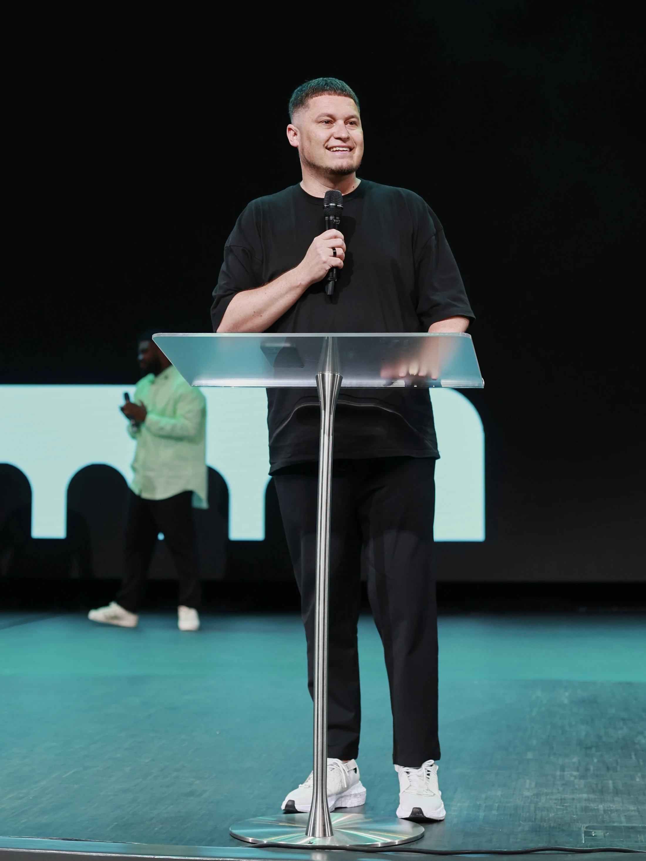 Eugene Voit speaking from a stage