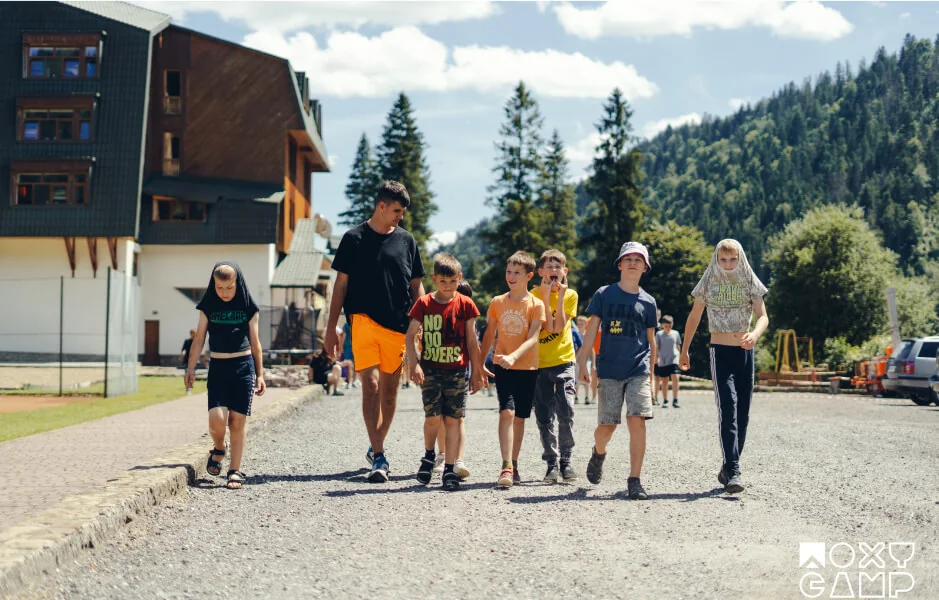 Children walking together at a camp in the Carpathians